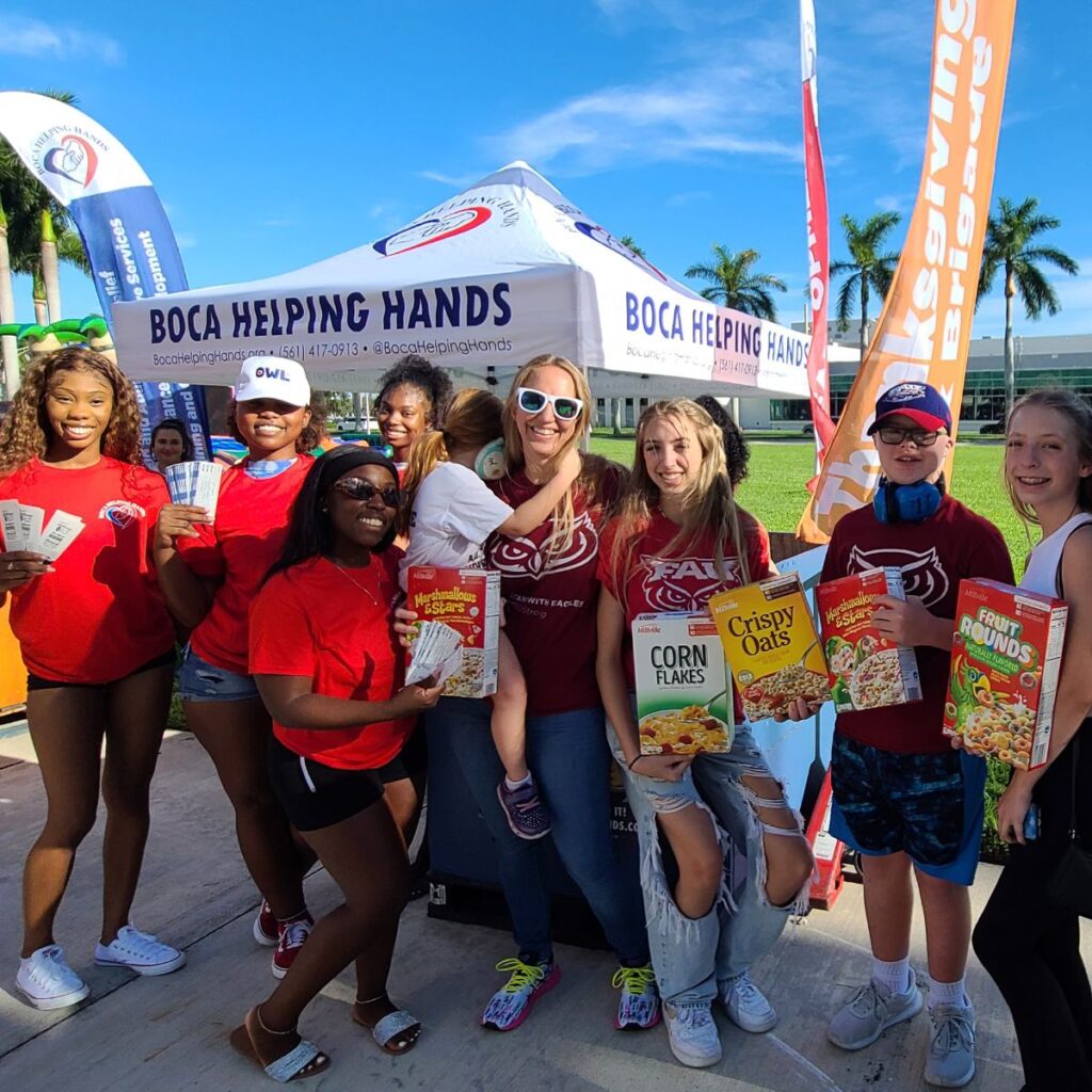 Tackle Hunger 2022 FAU CSC Volunteers with donating family_400x400