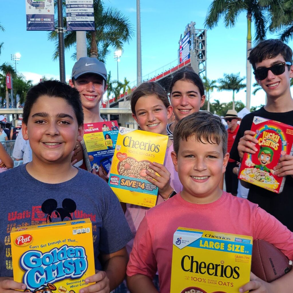 Tackle Hunger 2022 Luke and Jett with Hanna Hawkinson in middle from St Joan of Arc Catholic School_400x400 (1)