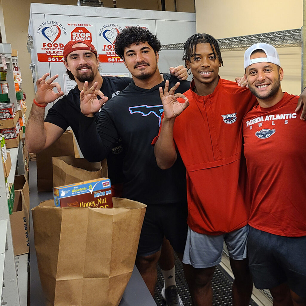 FAU Football Owls Packing Cereal at Food Bank